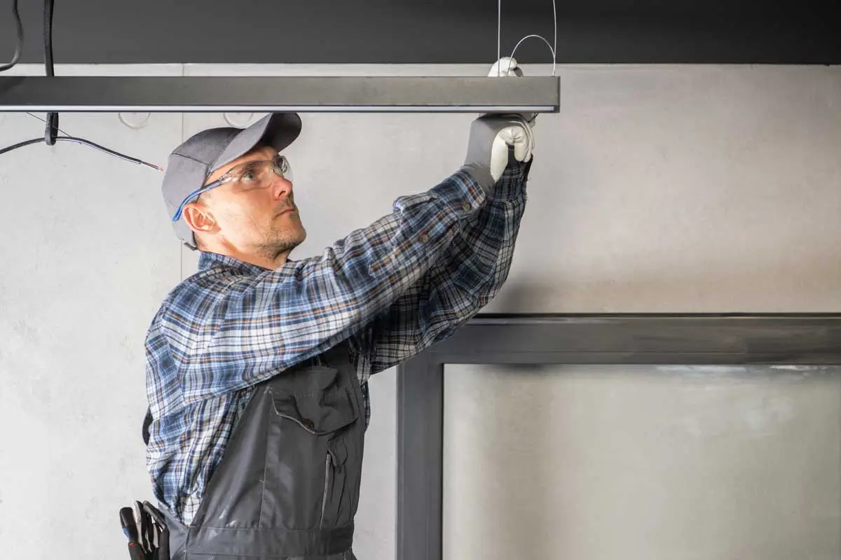 Garage Door Repair Digital Marketing Services 3 Experienced garage door repair professional completing installation with help from targeted garage door digital marketing services