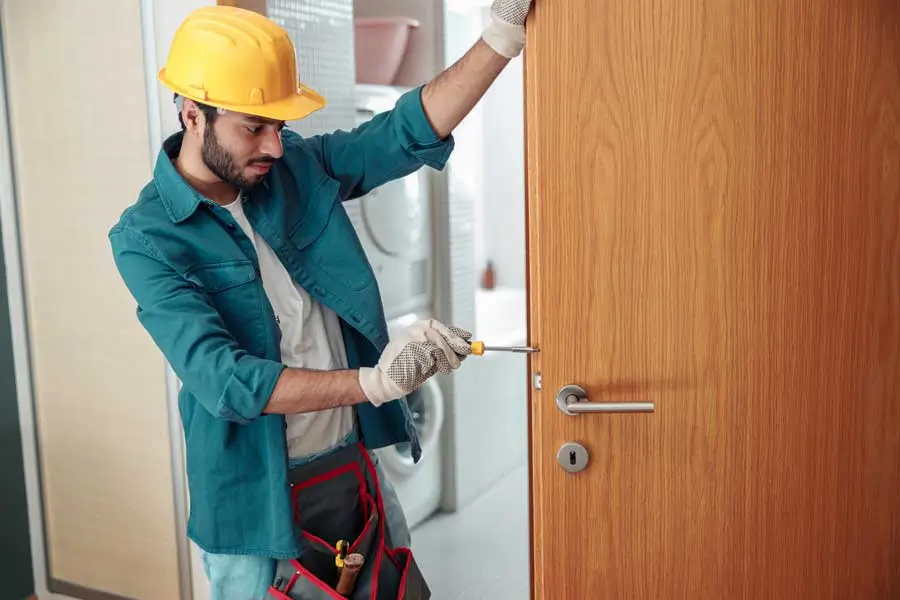 Repairman fixing door lock at home 2026 01 05 06 04 43 utc