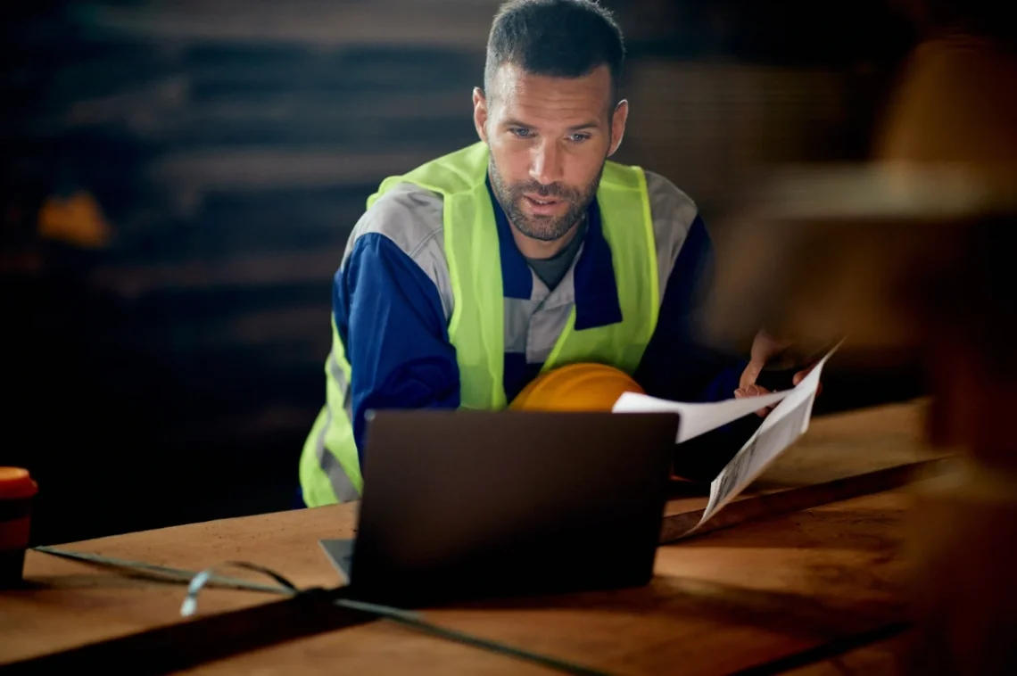 Technician reviewing campaign metrics and plans for garage door repair ads